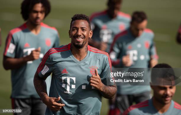 Jerome Boateng smiles during a training session at day seven of the Bayern Muenchen training camp at Aspire Academy on January 07, 2019 in Doha,...