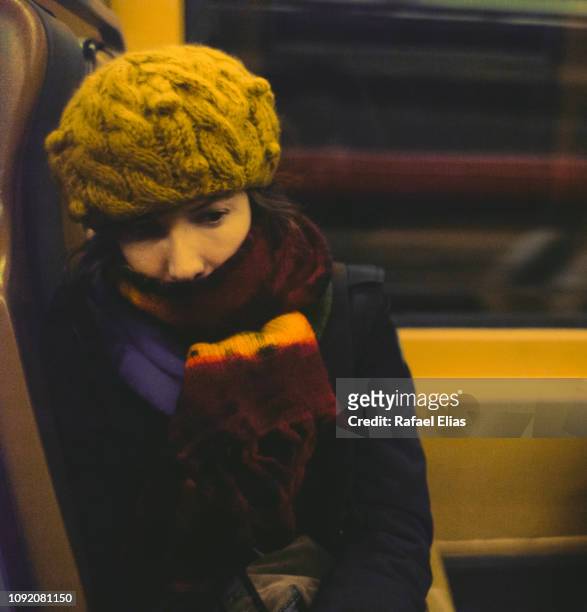 worried woman in carriage of the train - winter sadness stock pictures, royalty-free photos & images