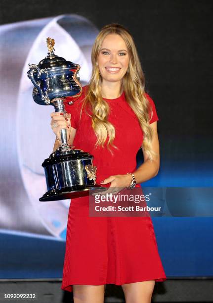 Caroline Wozniacki of Denmark poses with the the Daphne Akhurst Memorial Cup during the Official Draw ahead of the 2019 Australian Open at Margaret...