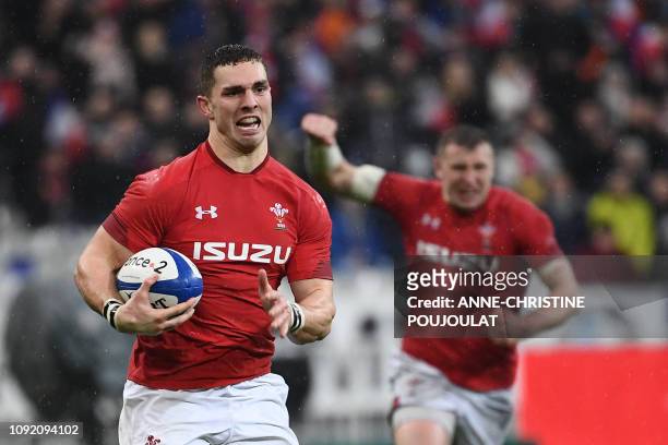 Wales' winger George North runs to score a try during the Six Nations rugby union tournament match between France and Wales at the stade de France,...