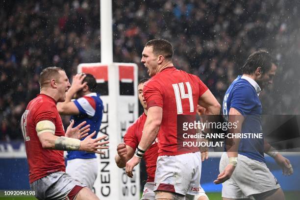 Wales' winger George North celebrates after scoring a try during the Six Nations rugby union tournament match between France and Wales at the stade...