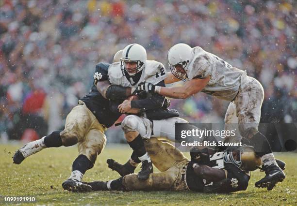 Kerry Collins, Quarterback for the Penn State Nittany Lions gets sacked during the NCAA Independent college football game against the Notre Dame...