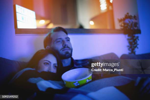 home movie tonight - young couple at movie together imagens e fotografias de stock