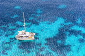 Sailboat yacht catamaran in beautiful Mediterranean bay