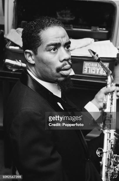 American jazz saxophononist and musician Eric Dolphy pictured in a dressing room backstage prior to performing with John Coltrane at the Gaumont...