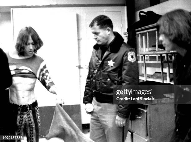 Iggy Pop of the Stooges seen backstage at Delta College with a County Sheriff on January 26, 1969.