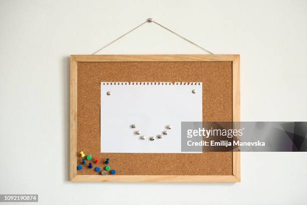 cork board with smiley face - bulletin stock pictures, royalty-free photos & images