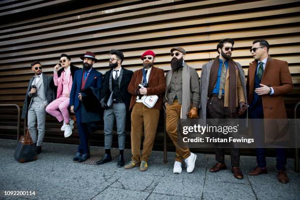 Men pose for a photograph during the 95th Pitti Uomo at Fortezza Da Basso on January 10, 2019 in Florence, Italy.