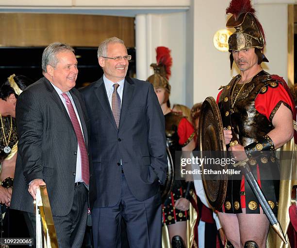 President of Caesars Entertainment Corp. Western Division Tom Jenkin, Caesars Palace President Gary Selesner and a Roman character wait for singer...