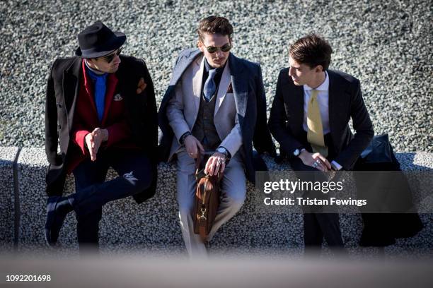 Men pose for a photograph during the 95th Pitti Uomo at Fortezza Da Basso on January 10, 2019 in Florence, Italy.