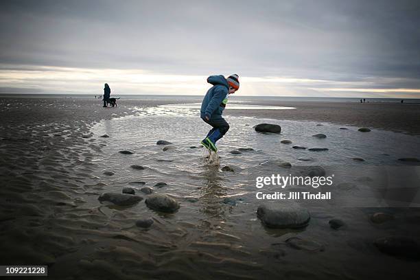 jumping in rockpools - st bees stock pictures, royalty-free photos & images