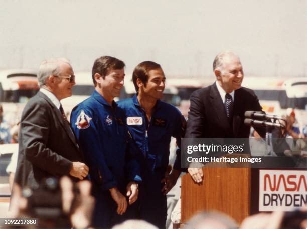 Astronauts John Young and Robert Crippen after landing, Edwards Air Force Base, California, USA, April 1981. US astronauts Young and Crippen were the...