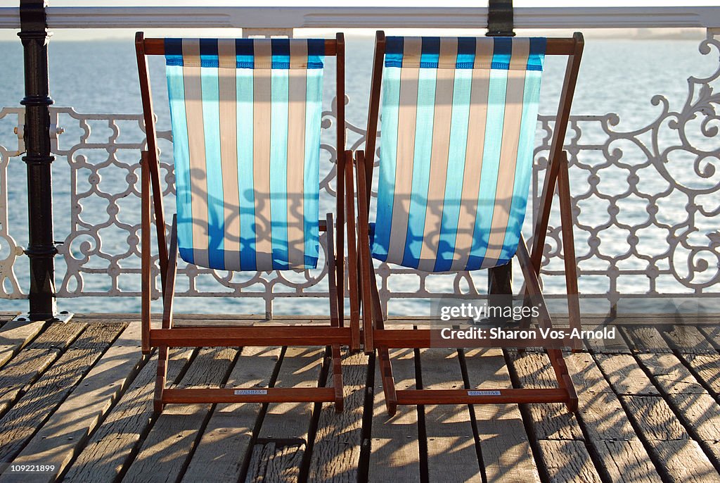 Blue & White Striped Deckchairs on a Pier