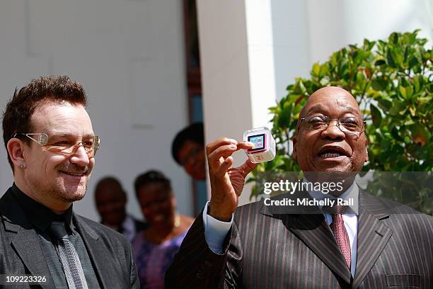 President Jacob Zuma of South Africa meets with Bono from U2 at the Genadendaal Residence on February 17, 2011 in Cape Town, South Africa.