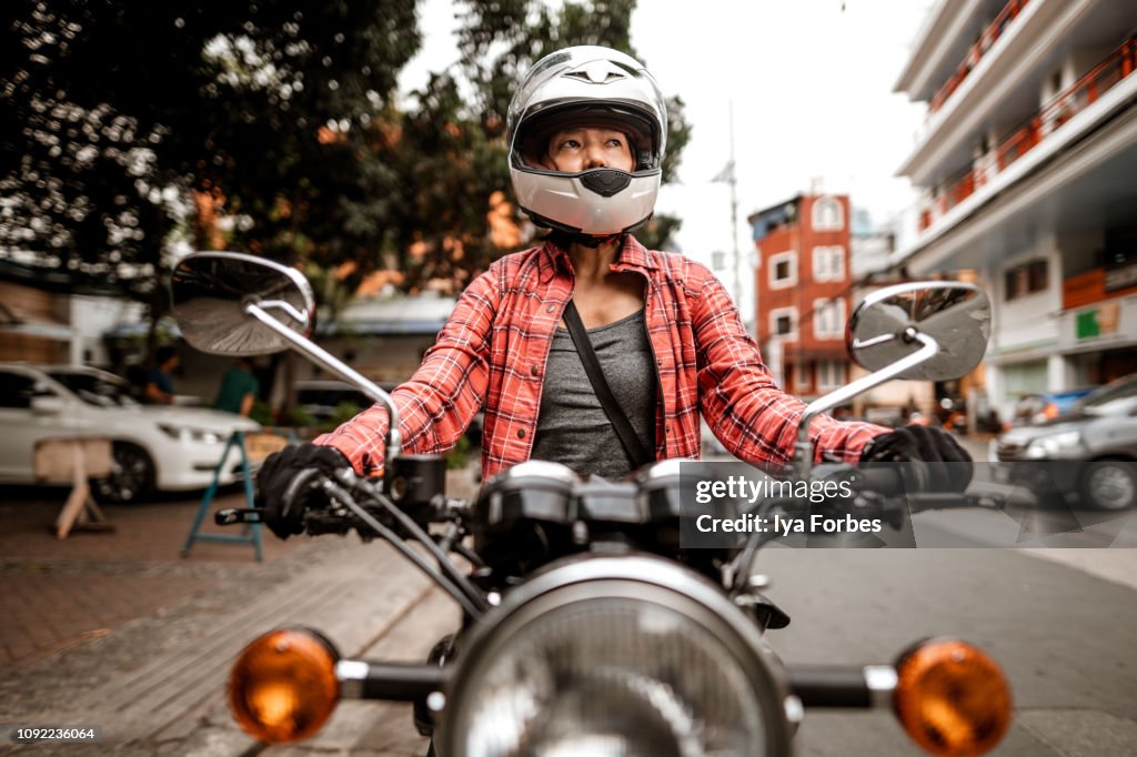 Filipino motorcyclist on motorcycle