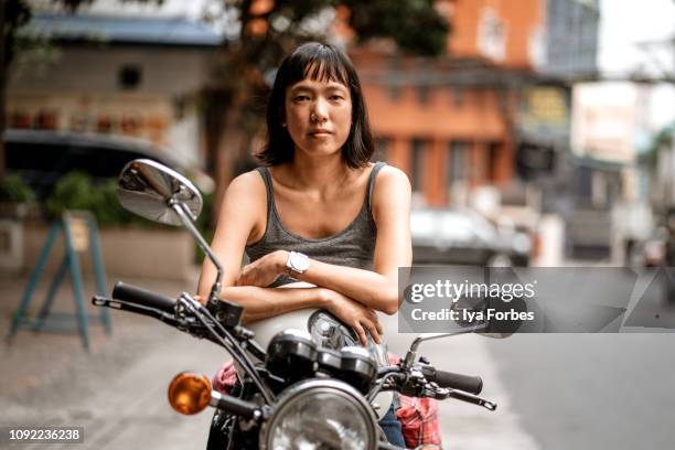 filipino motorcyclist on motorcycle - filipino woman fotografías e imágenes de stock