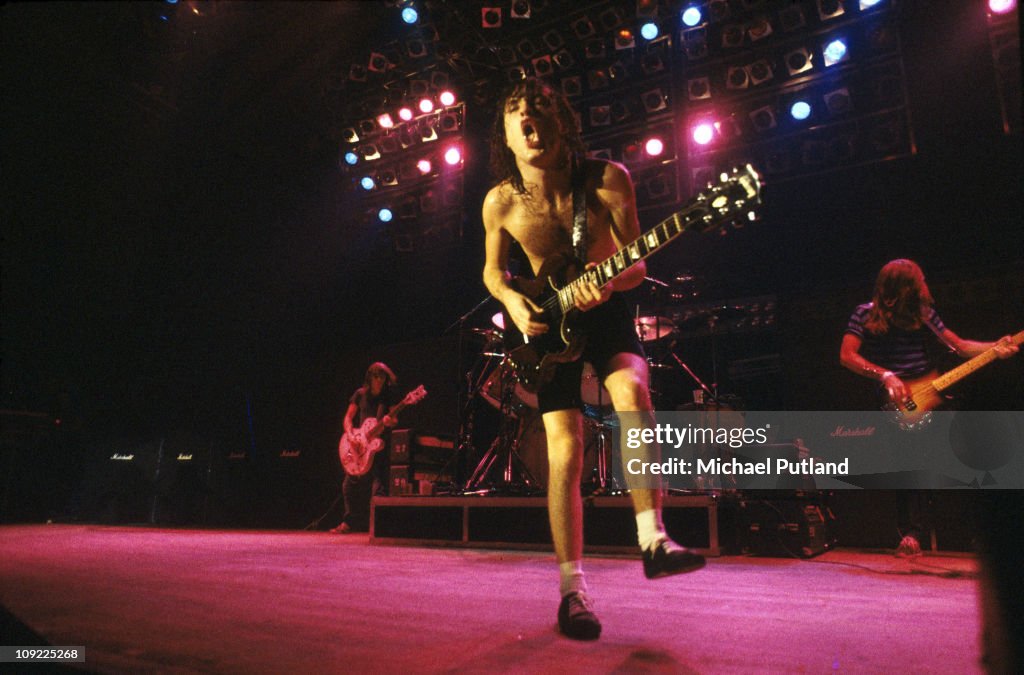 AC/DC perform on stage in London Angus Young, Cliff Williams. Photo d ...