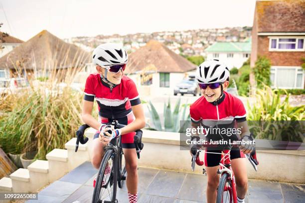 two boys posing outside their house before a bike ride - family sports centre laughing stock pictures, royalty-free photos & images