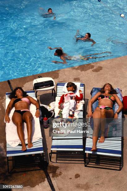 Dummy lies between two real girls at the annual ventriloquist convention JANUARY 1, 1990