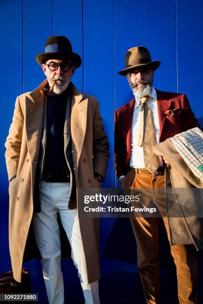 Men pose for a photograph during the 95th Pitti Uomo at Fortezza Da Basso on January 10, 2019 in Florence, Italy.
