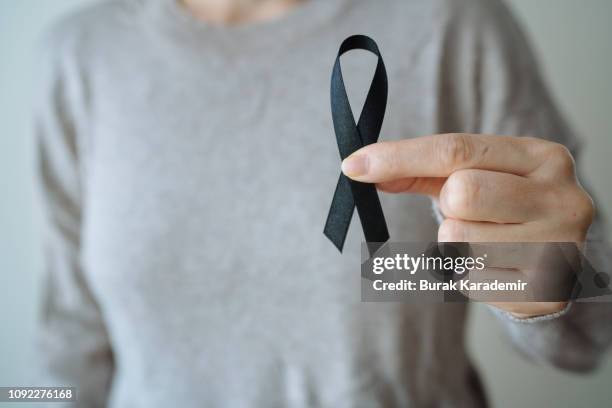 black awareness ribbon - remembrance day icon stock pictures, royalty-free photos & images