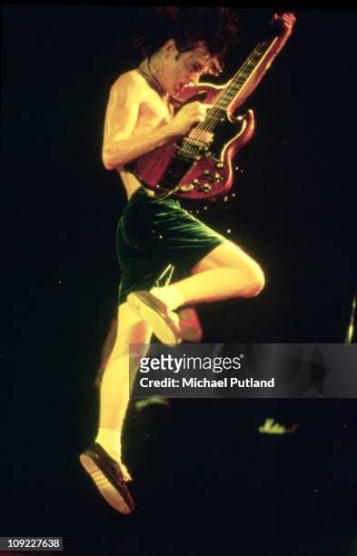 Perform on stage in London Angus Young.