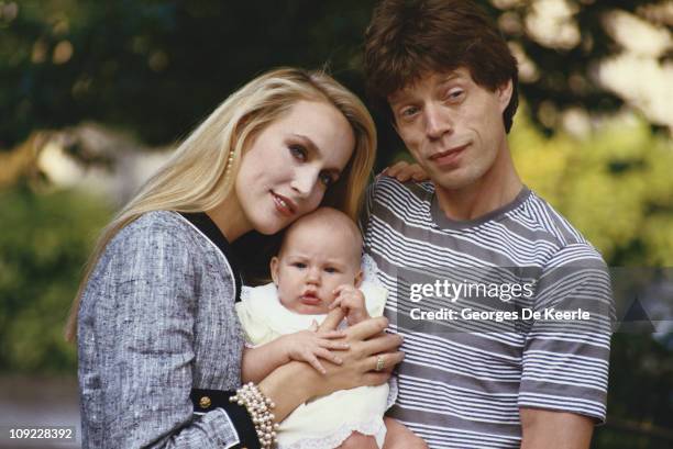 Mick Jagger and Jerry Hall with Elisabeth Jagger, circa 1984.