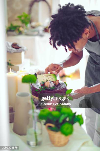 happy easter! - decorating a cake stock pictures, royalty-free photos & images