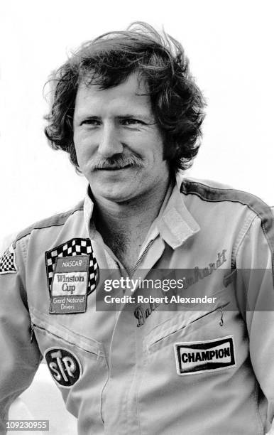 Dale Earnhardt Sr, driver of the Wrangler Ford Thunderbird, relaxes at the Daytona International Speedway prior to the start of the 1982 Daytona 500...