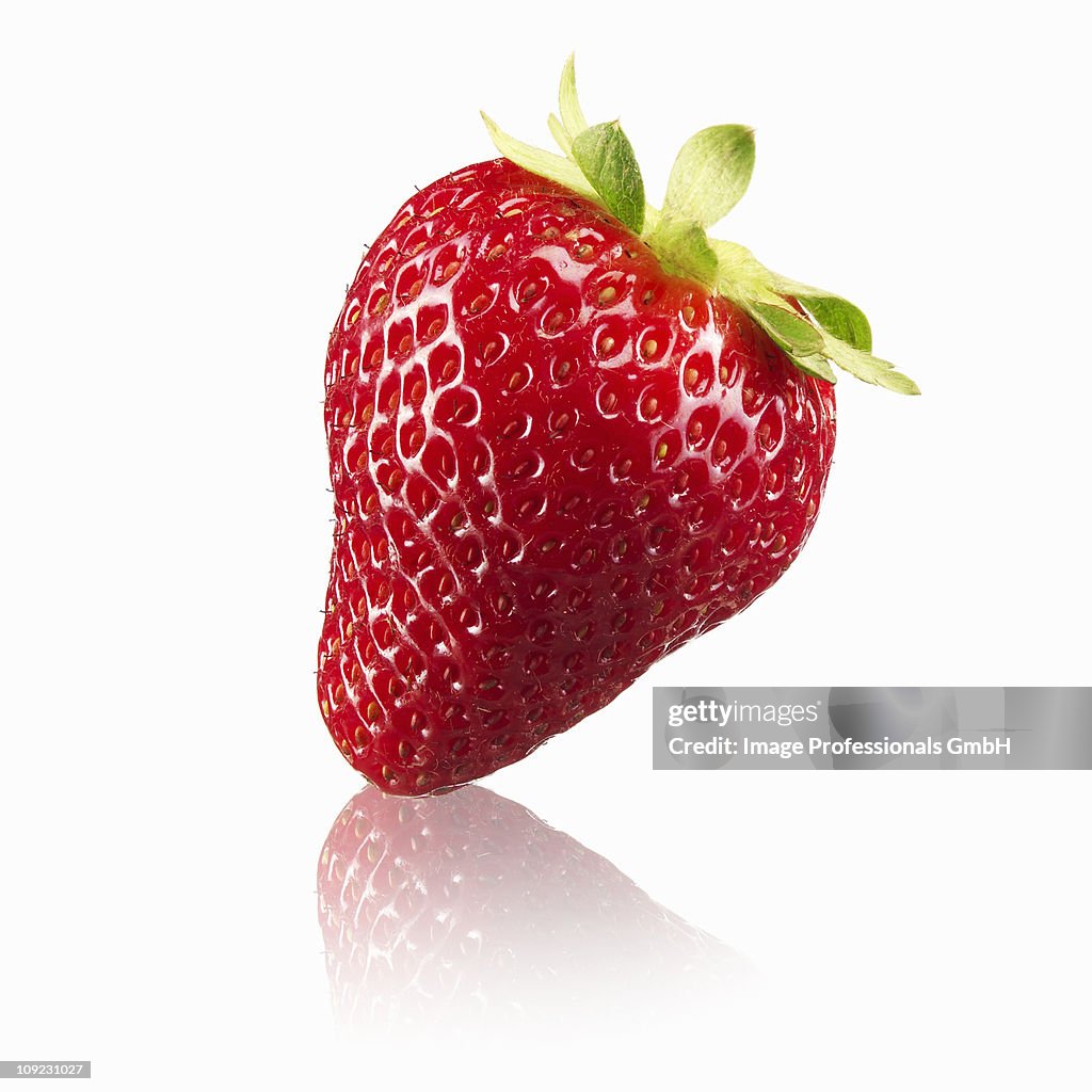 Single strawberry on white background, close-up
