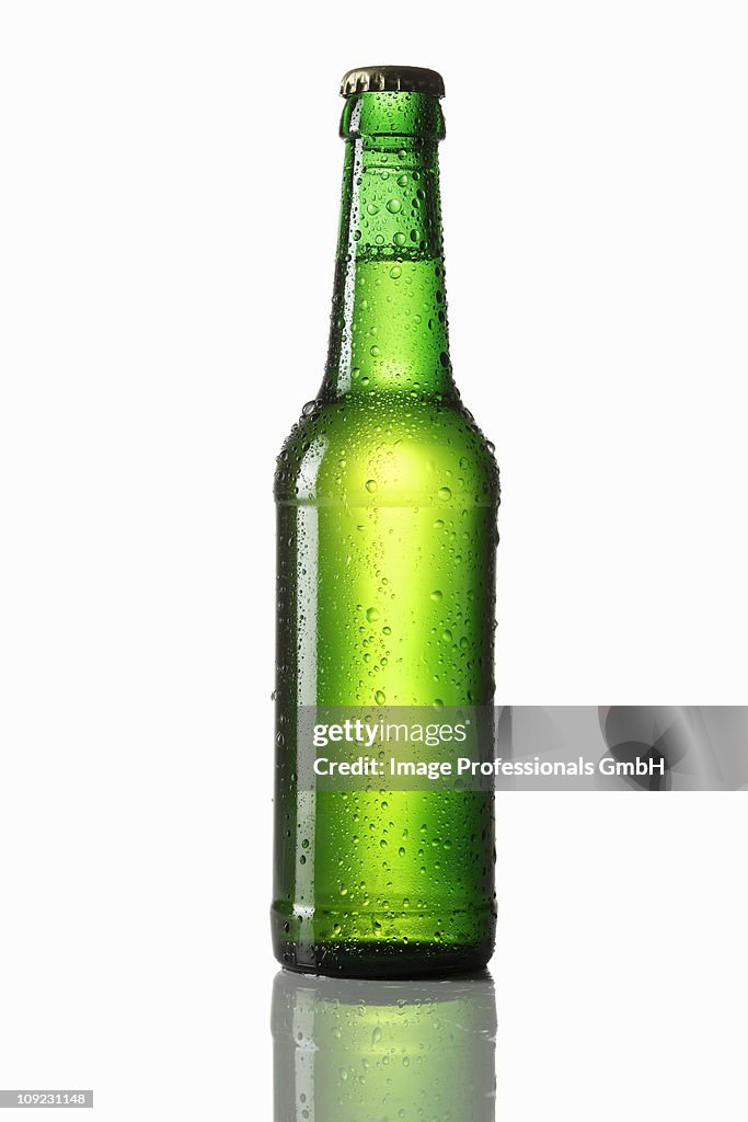 Water drops on green beer bottle