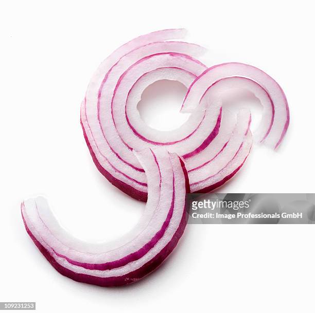 red onion rings on white background, close-up - red onion white background stock pictures, royalty-free photos & images