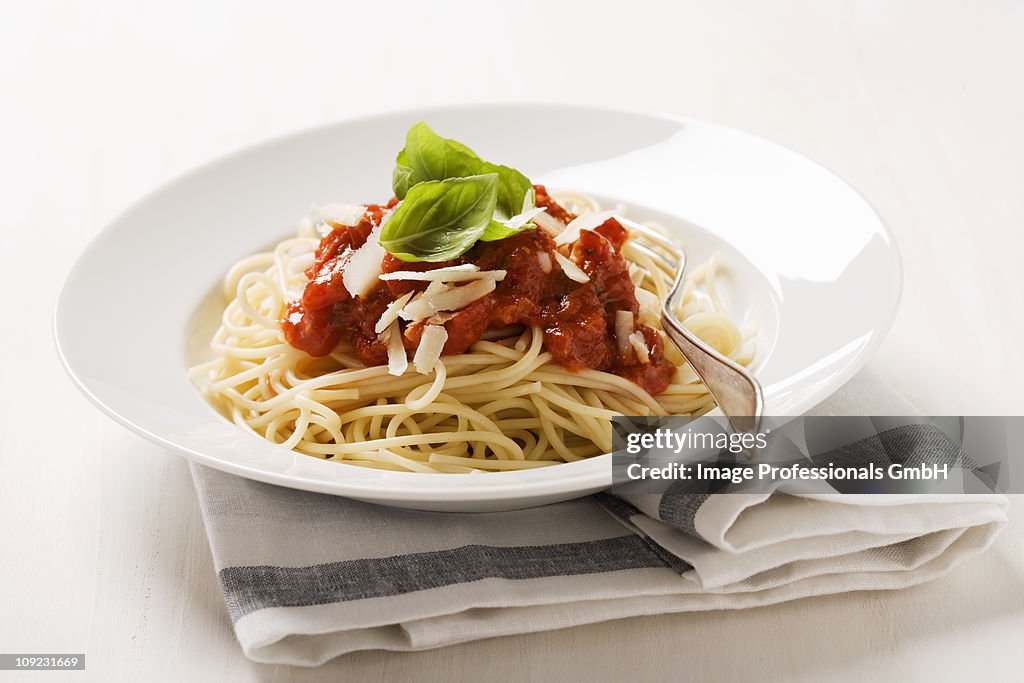 Spaghetti with tomato sauce and parmesan on plate