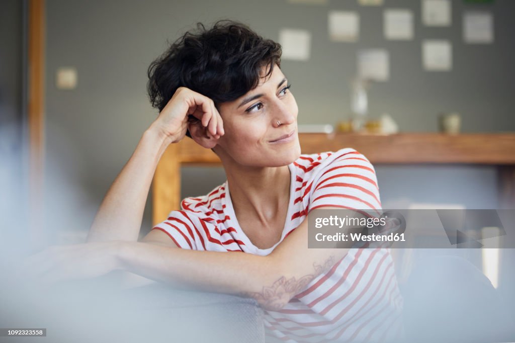 Portrait of woman at home thinking