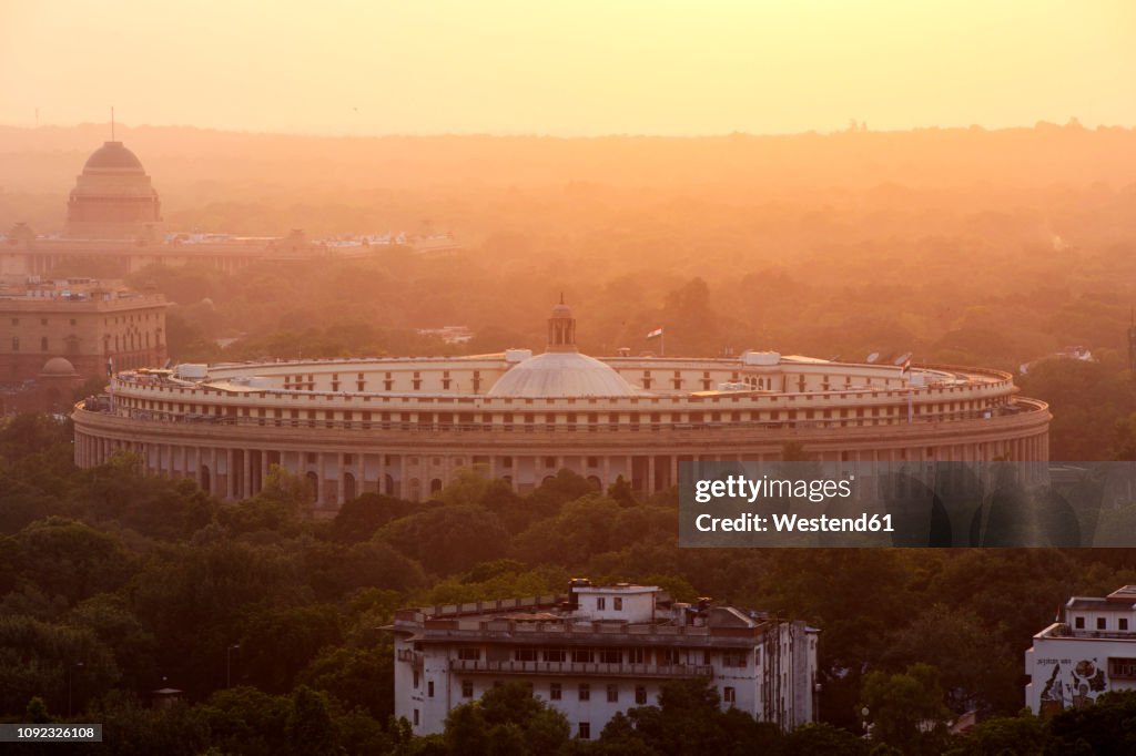 India, Delhi, New Delhi, Parliament Building at sunset, pollution, smog