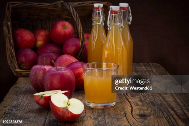 red apples and apple juice - apple juice stock pictures, royalty-free photos & images