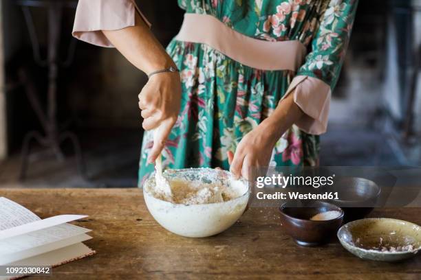 young woman preparing cake dough, partial view - cookbook stock pictures, royalty-free photos & images