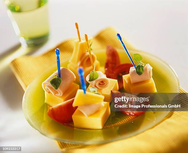 cocktail sticks in cheese and ham with tomatoes on plate - cocktail stick stock pictures, royalty-free photos & images