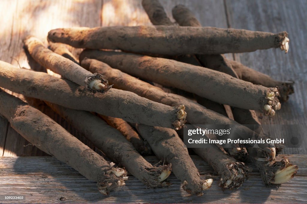 Black salsify on plank, close-up