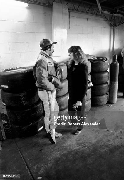 Dale Earnhardt Sr. And his wife, Teresa Earnhardt, have a personal conversation alone in the Daytona International Speedway garage prior to the start...
