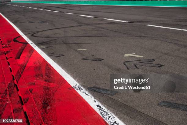 markings and skidmarks on racetrack - road marking stock pictures, royalty-free photos & images