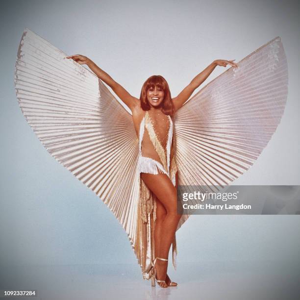 American singer, Tina Turner posing in a winged-costume, Los Angeles, California, 1977.