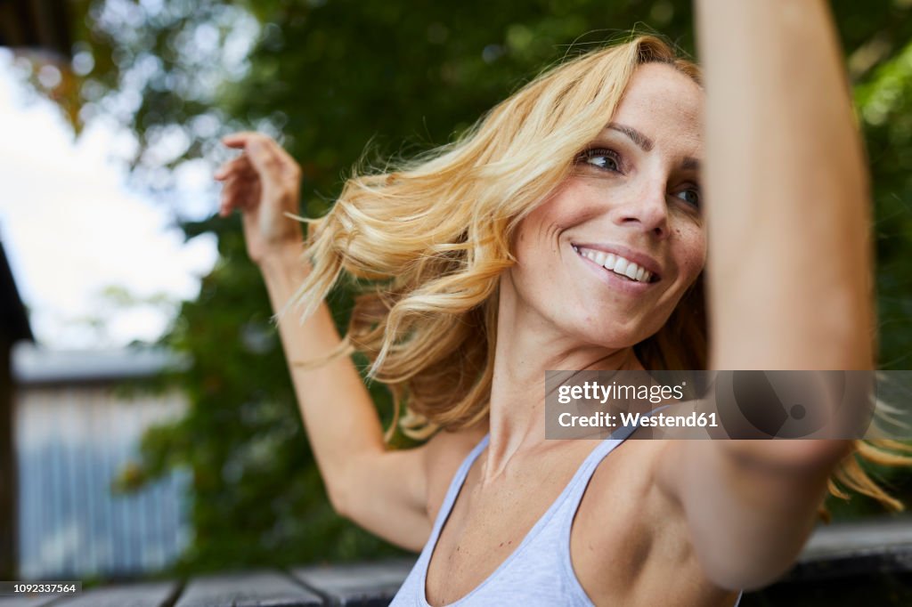 Carefree blond woman outdoors