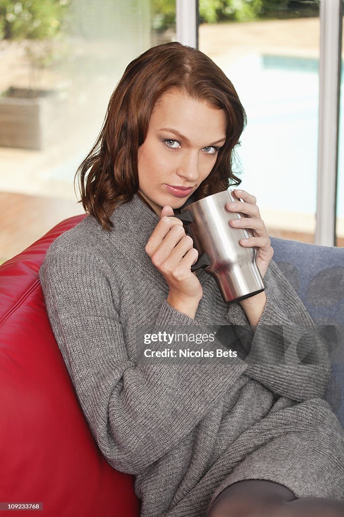 Young woman holding cup