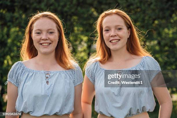 smiling redheaded twins - twin girls bildbanksfoton och bilder