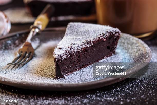 swedish kladdkaka, dark chocolate cake, swedish brownie, with coffee, close-up - chocolate cake foto e immagini stock