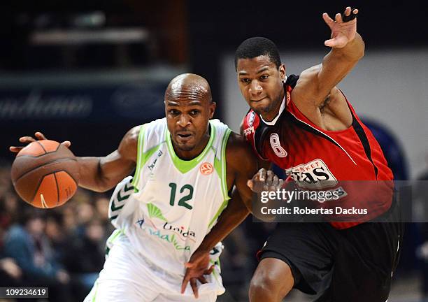 Roderick Blakney, #12 of Unicaja competes with Darryl Strawberry, # 8 Lietuvos Rytas during the 2010-2011 Turkish Airlines Euroleague Top 16 Date 4...