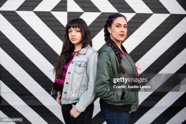 Two Latina Girlfriends Standing Together, Casual, Geometric Background