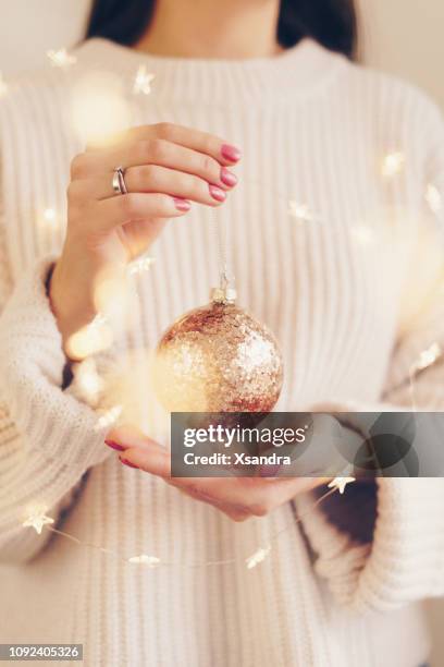 christmas concept: woman holding christmas decorations - pastel christmas stock pictures, royalty-free photos & images