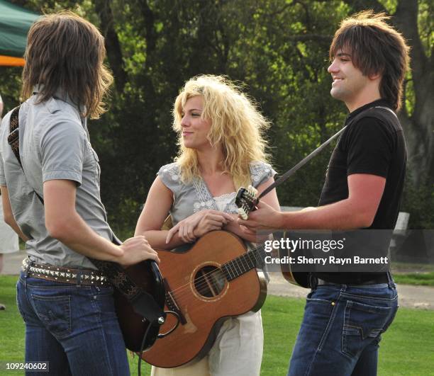 Reid Perry, Kimberly Perry and Neil Perry from the musical group The Band Perry backstage at the Golf and Guitars charity event on May 18, 2010 at...